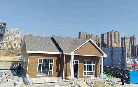 咖啡色尖顶轻钢别墅图